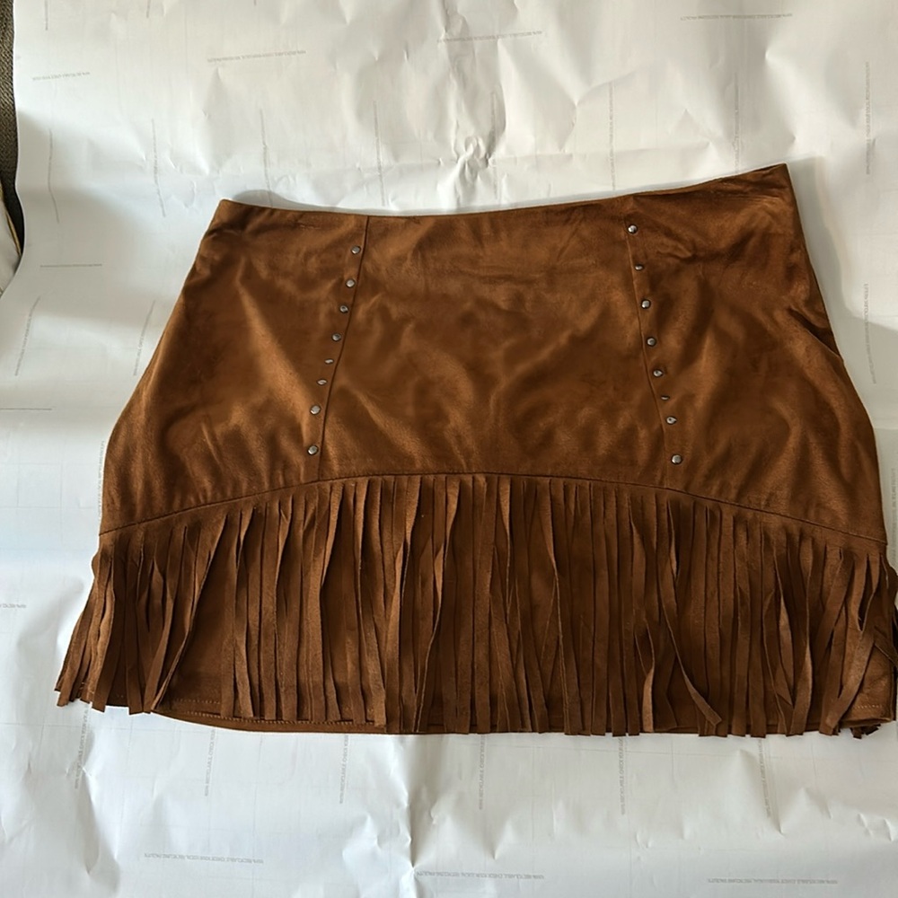 Suede Carmel color fringe skirt. With studs,